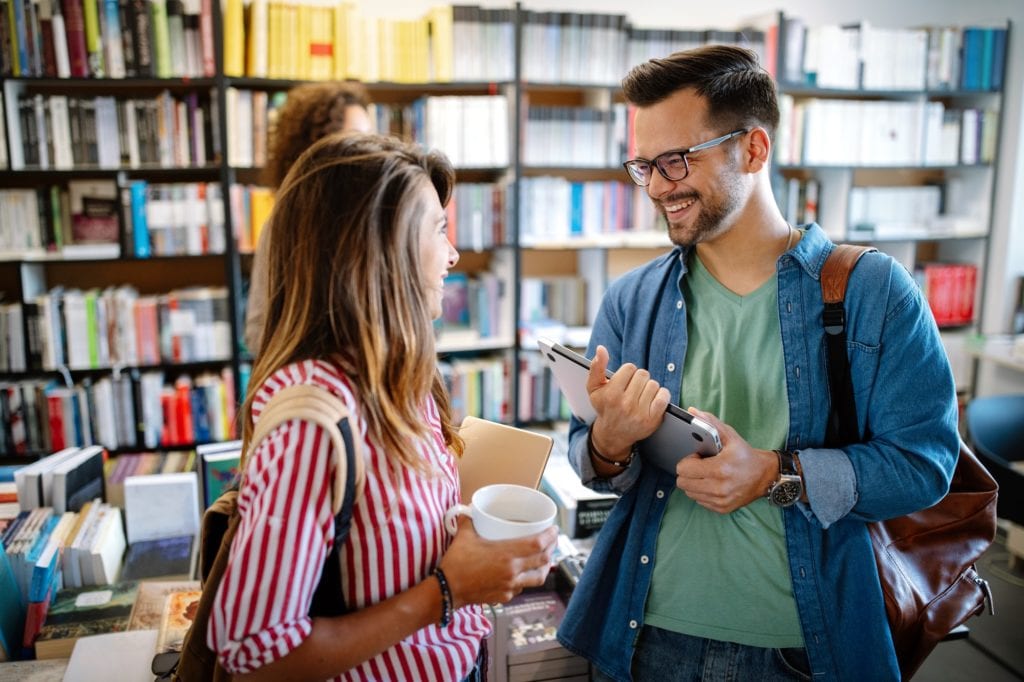 Group of college students studying in the school library